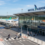 Bristol Airport terminal and Transport Interchange with passengers travelling through the airport