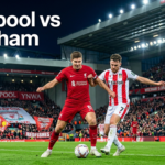 Liverpool and Wrexham players competing during a pre-season football match in a packed stadium with supporters cheering.
